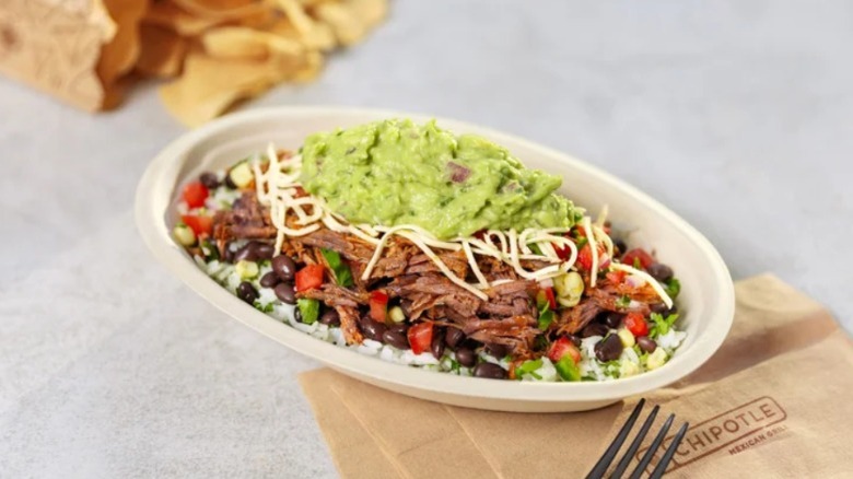 A Chipotle barbacoa beef burrito bowl topped with guacamole