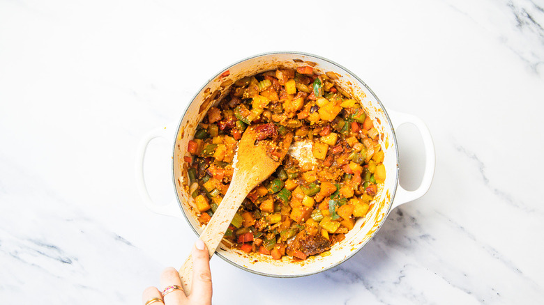 Stirring a large pot of turkey chili