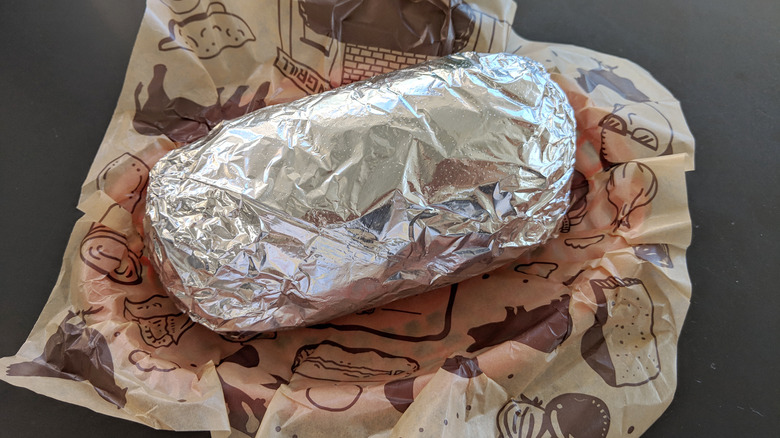 Chipotle burrito in foil on a bag