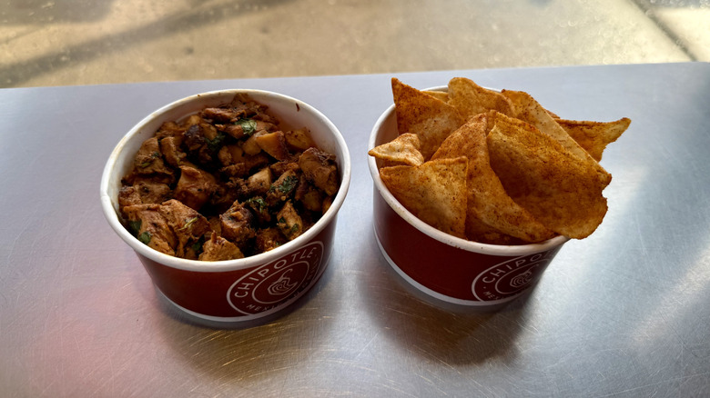 A cup of Pollo Asada and Chili Lime Chips