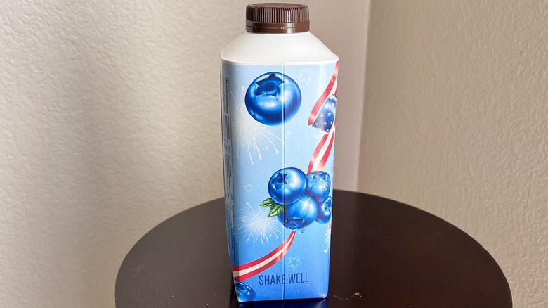 Chobani American Blueberry coffee creamer on a table, seen from the side