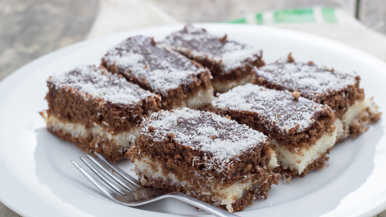 A plate of gooey chocolate coconut dump cake slices