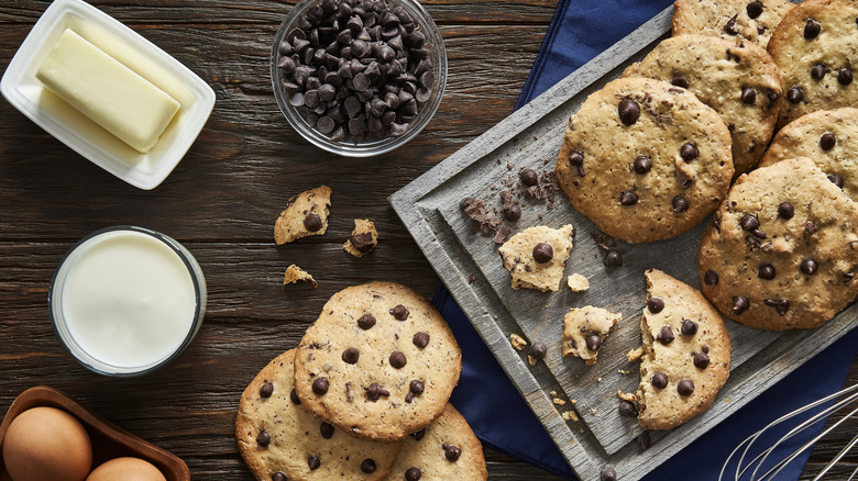 making chocolate chip cookies with ingredients on table