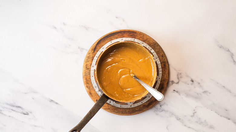 Lemon curd caramel in saucepan
