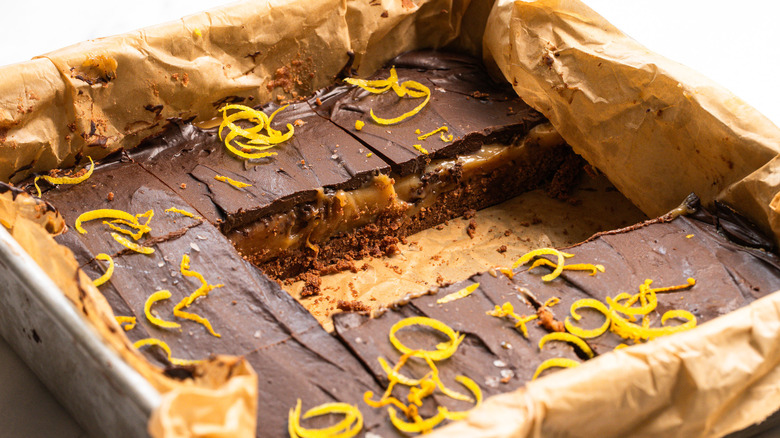 Tray of chocolate lemon bar slices with a couple of slices taken out