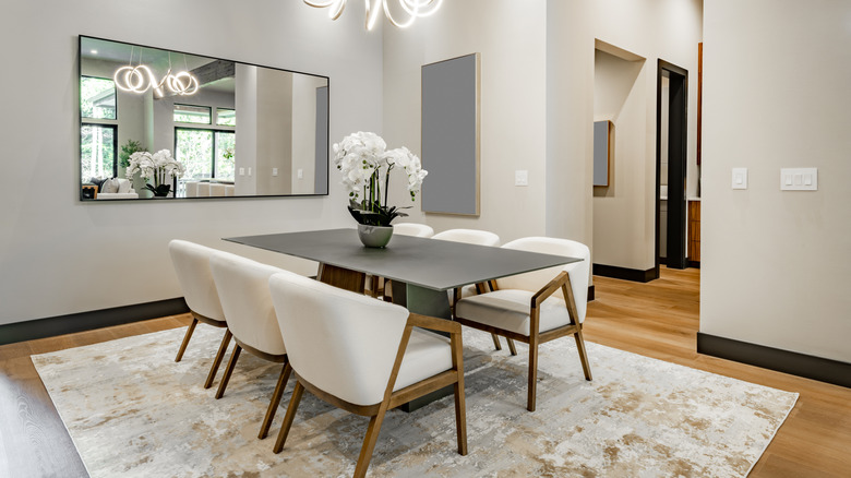 view of dining room table with rug underneath