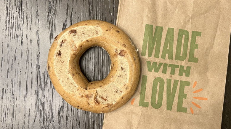 Panera Bread cinnamon raisin bagel on to-go bag.