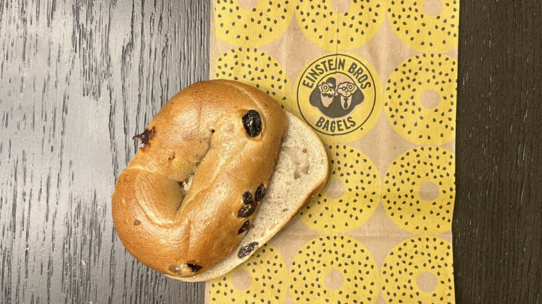 Einstein Bros. cinnamon raisin bagel on to-go bag.