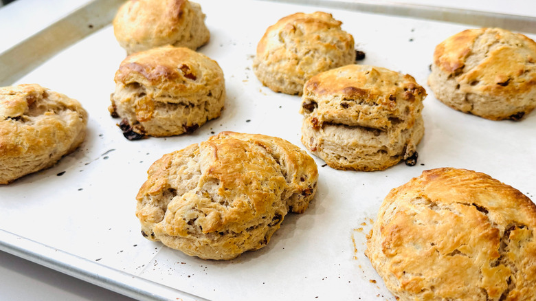 Baked cinnamon raisin biscuits in baking sheet