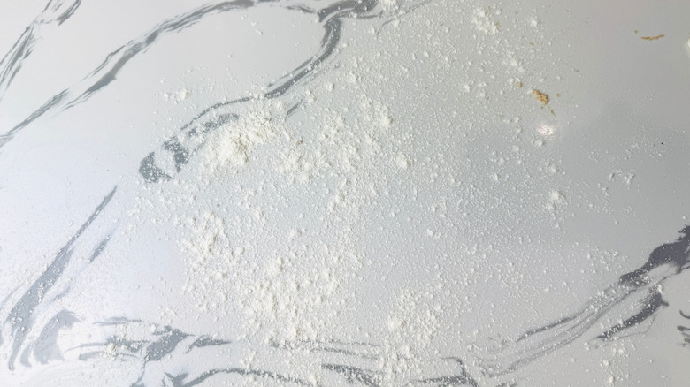 Flour sprinkled on countertop