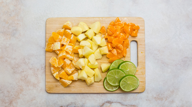 chopped fruit on cutting board