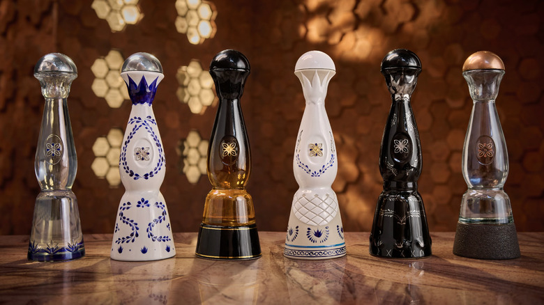 bottles of Clase Azul tequila lined up on a table