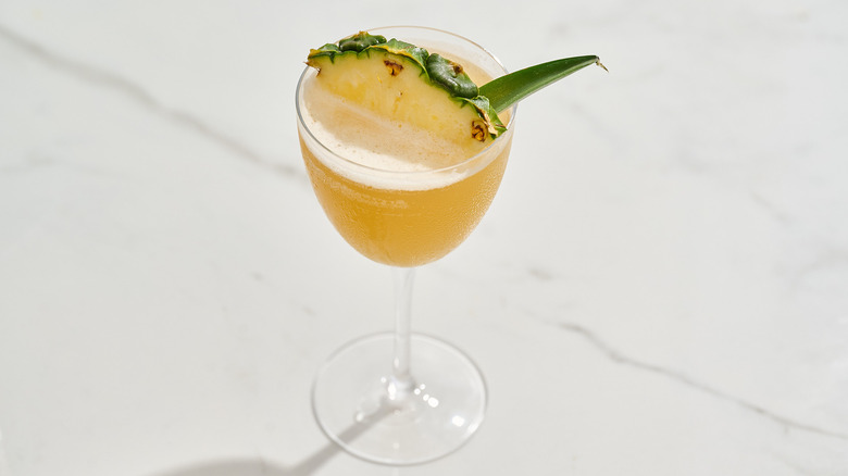 algonquin cocktail in a glass on a table