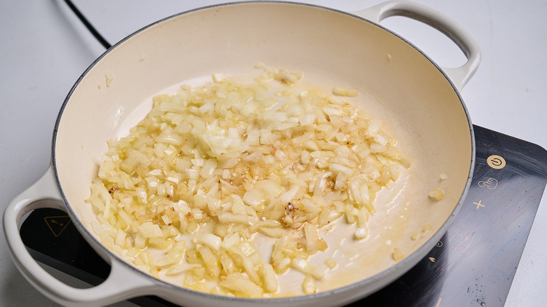 cooking onion and garlic in large skillet