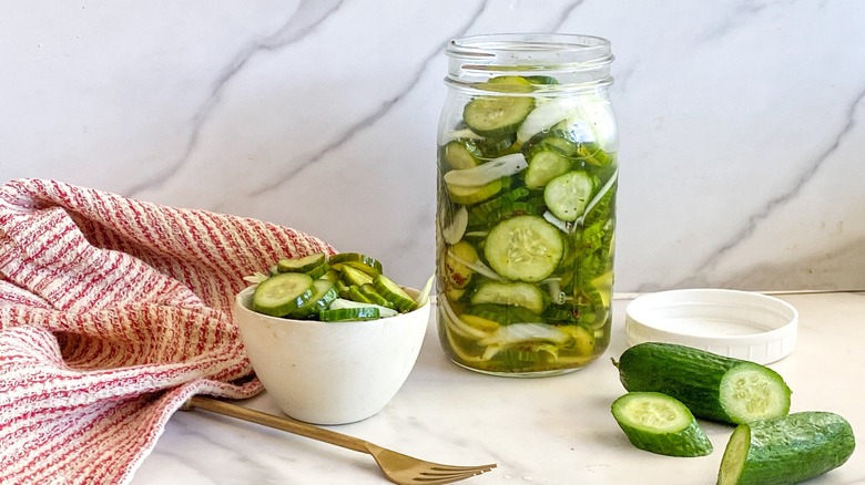 pickles in jar and bowl