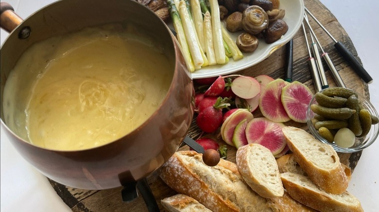 cheese fondue and veggies and baguette