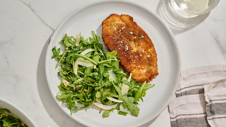 chicken cutlet with salad on a plate
