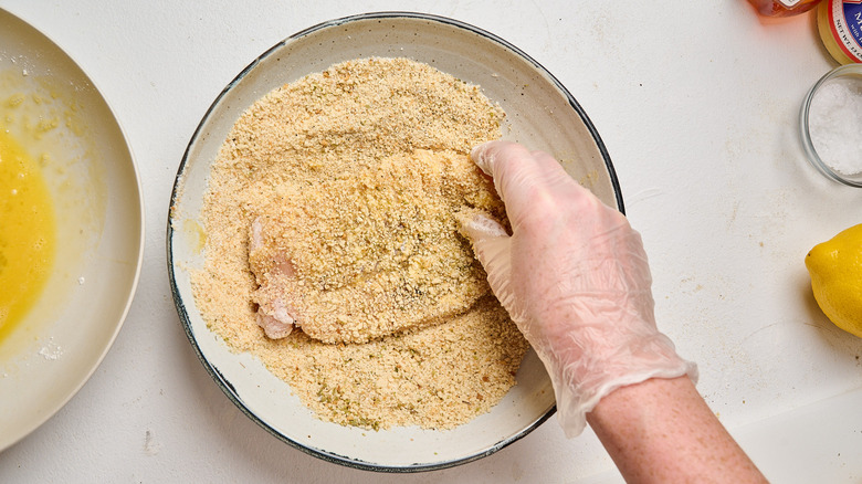 coating chicken in breadcrumbs