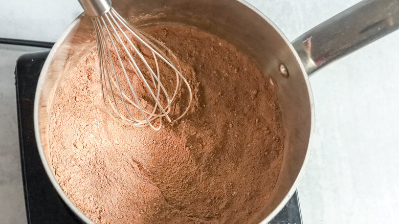 cocoa powder in a metal pot