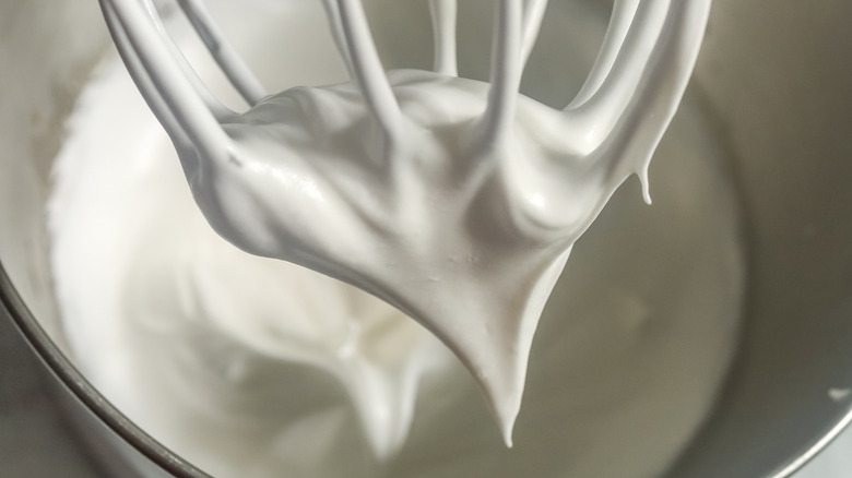 whipped egg whites in a mixing bowl