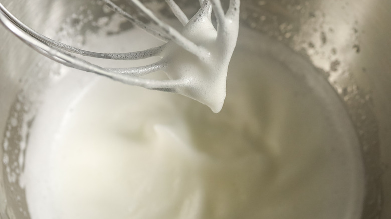 lightly whipped egg whites in a mixing bowl