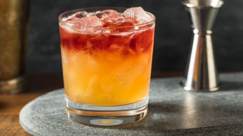 New York Sour cocktail with layer of port on stone tray