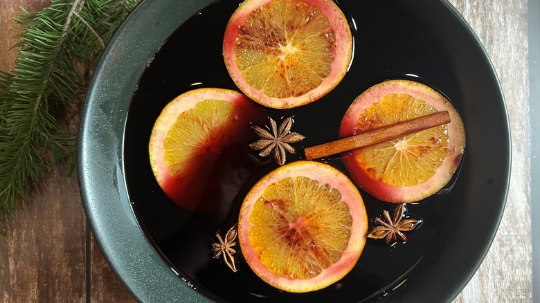 wine in pot with oranges and spices