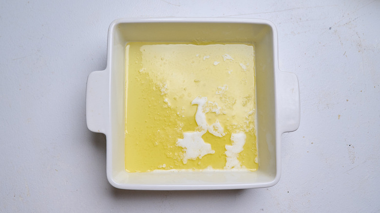 melted butter in a baking dish