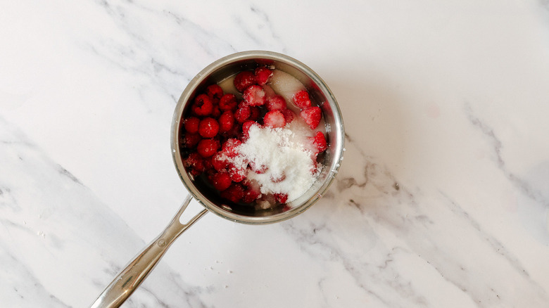 raspberries, sugar and lemon juice in saucepan