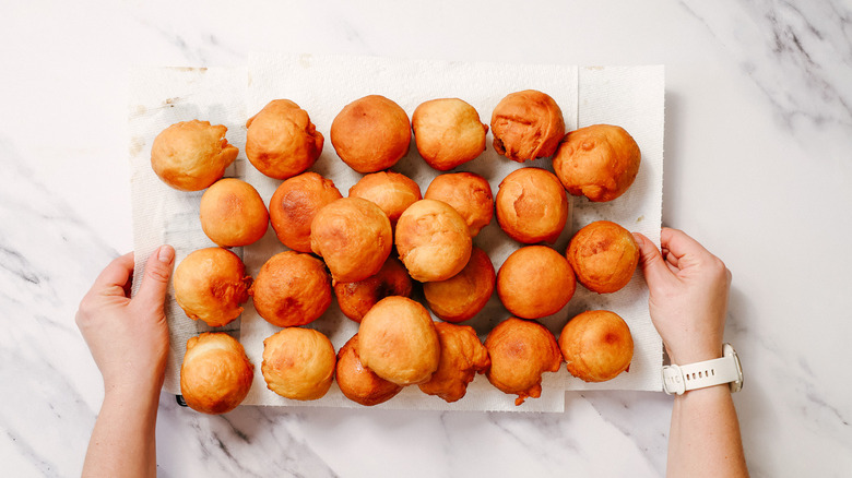 Fried donuts on paper towels