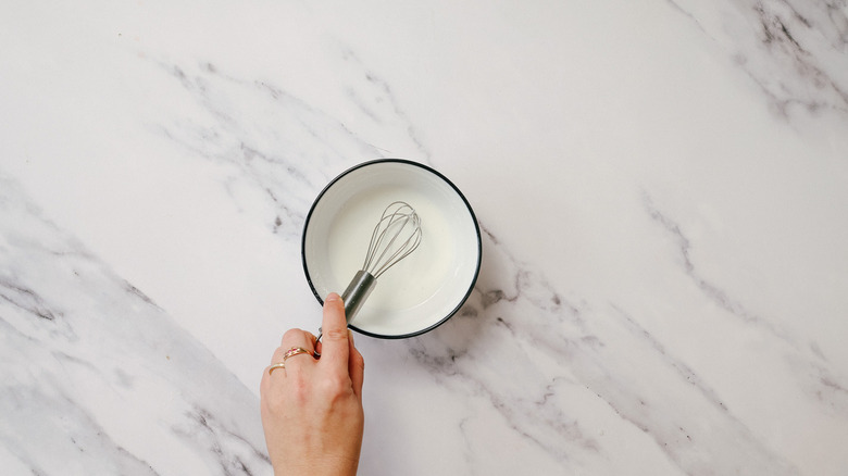Hand whisking cornstarch mix
