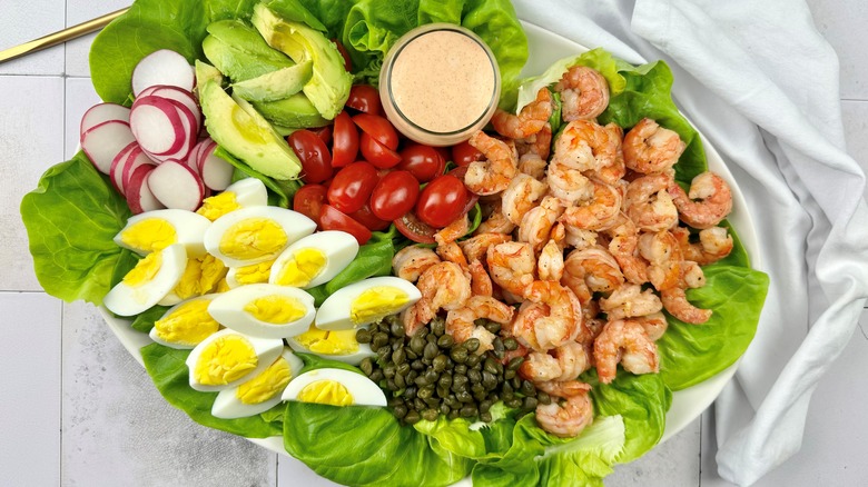 shrimp louie salad with eggs and avocado
