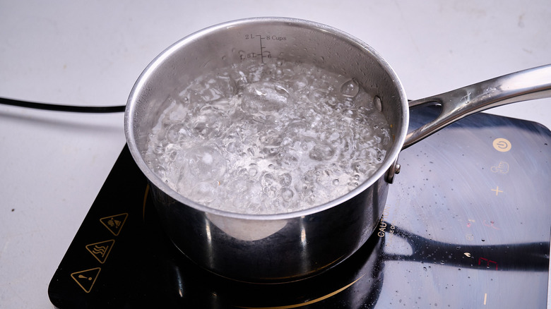 boiling water on a stove