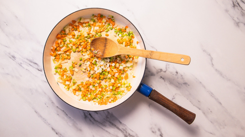 Carrot celery and onion in pan