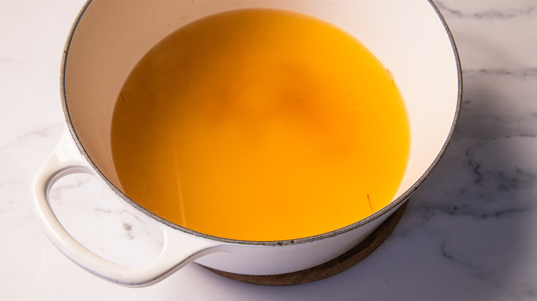 Saffron broth in pot
