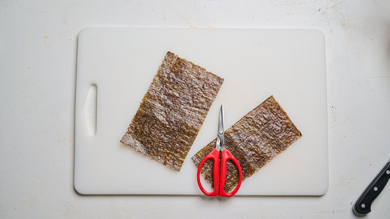 nori sheet cut in half with scissors