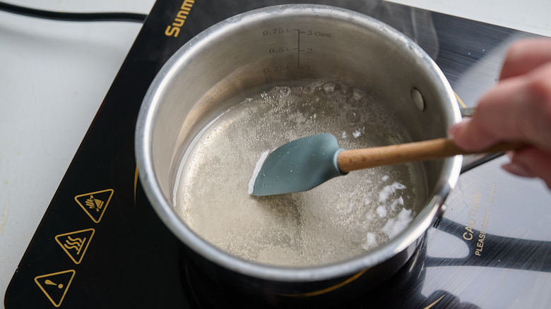 cooking vinegar and sugar in pot