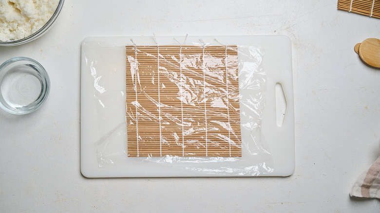 bamboo mat covered with plastic wrap
