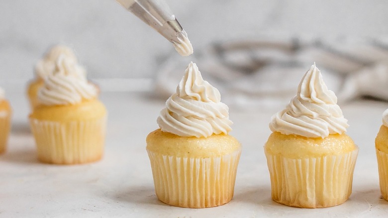 frosting piping onto cupcake