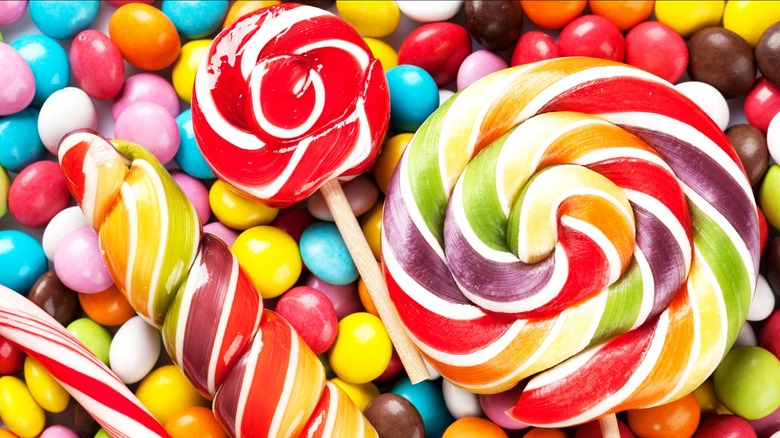 Close-up of colorful lollipops and other candies