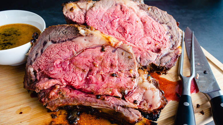 A cross section of a beautifully cooked, juicy prime rib