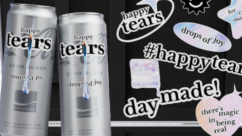 Close-up of the Coca-Cola Happy Tears box and cans