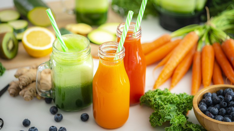 Three different juices with assorted fruits and vegetables