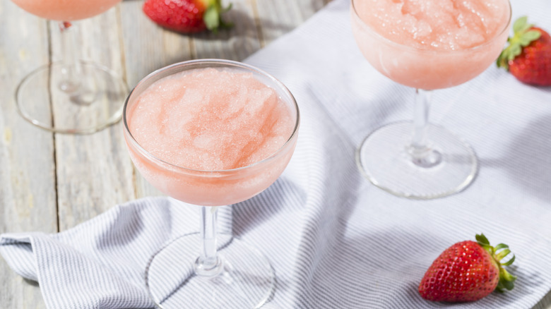 Frozen frosé cocktails on white sheet