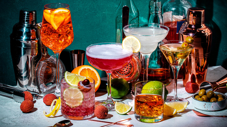 Assorted cocktails and bottles on bar