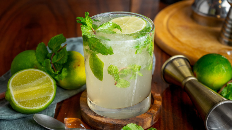 Mojito and lime on wooden board