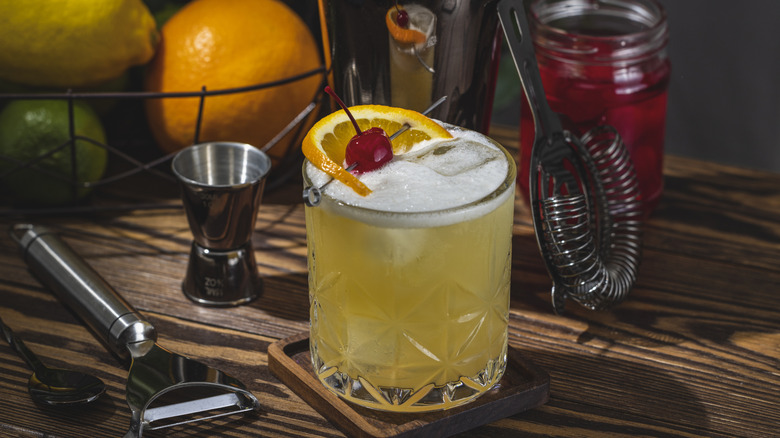Whiskey sour with cherry and orange