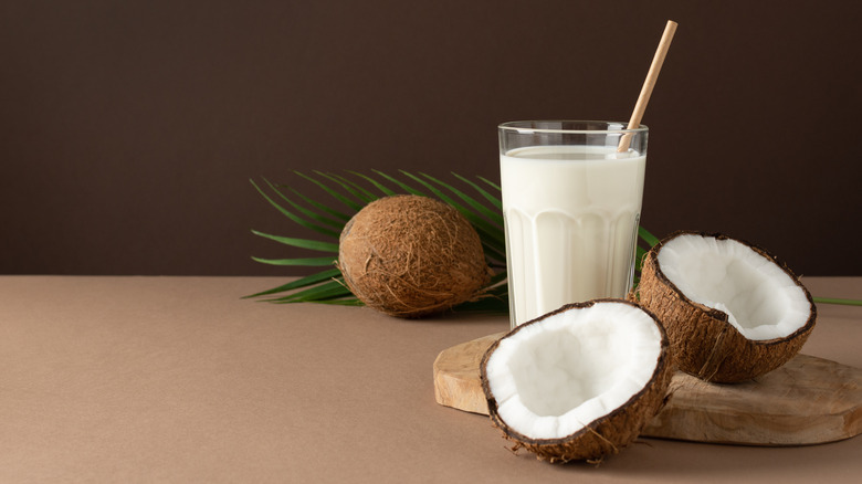 coconuts and glass of coconut milk