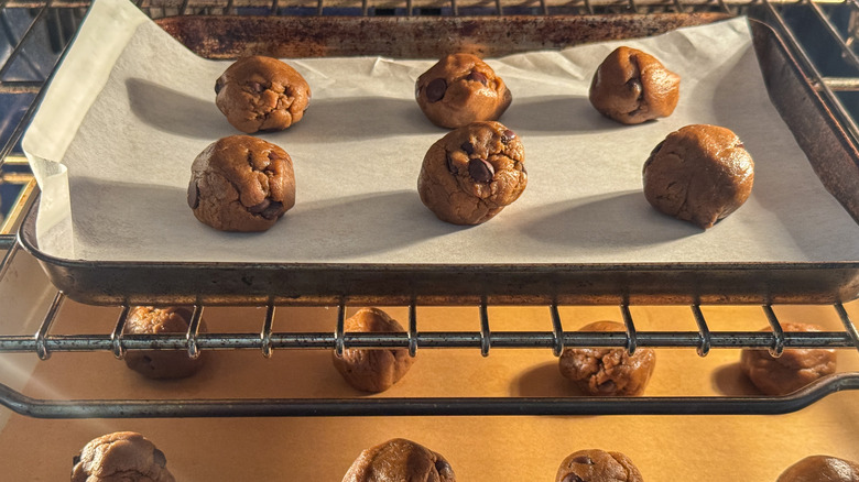 cookies dough balls baking in oven