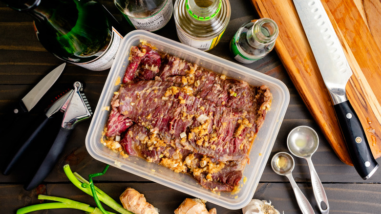 Soy sauce, ginger, and garlic marinating steak